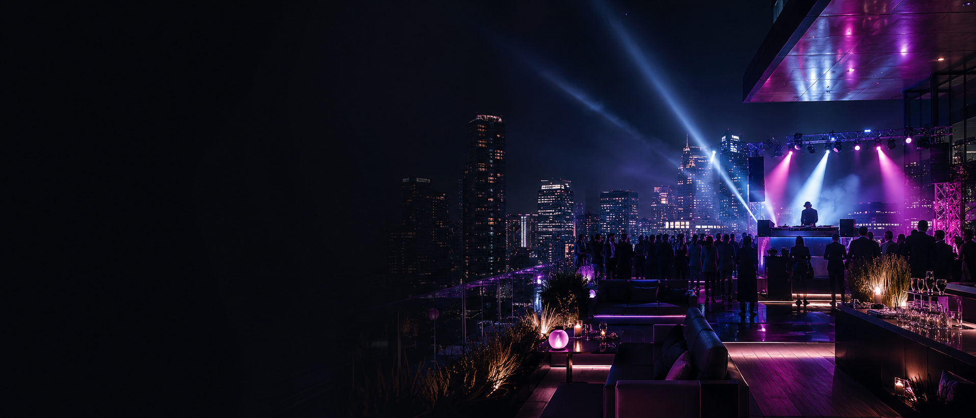 Luxury rooftop event with DJ and atmospheric lighting